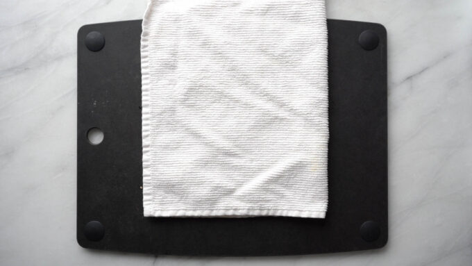 kitchen towel on cutting board