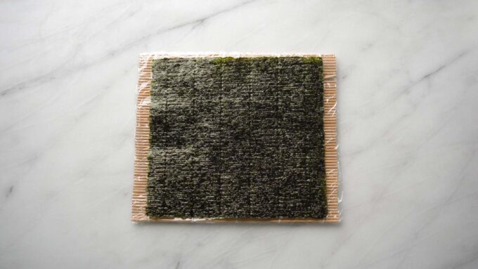 full sheet of nori on sushi mat