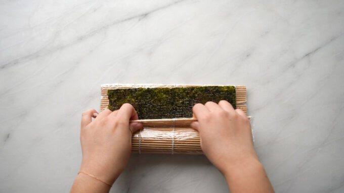 press sushi mat into log shape