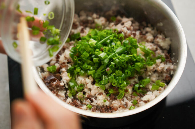 adding chopped green onion