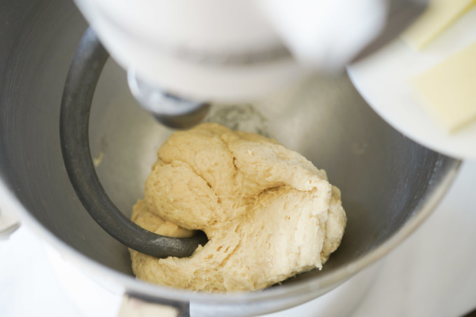 adding softened butter to stand mixer