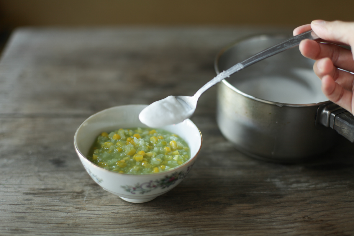 topping off with scoop of coconut cream before serving