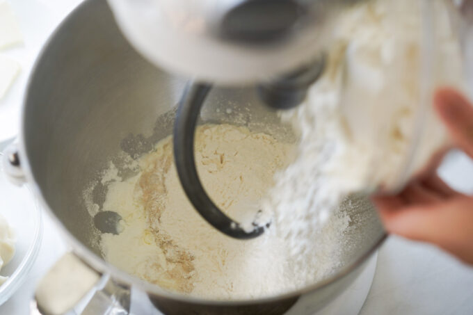 adding ingredients into stand mixer