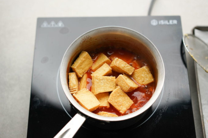 fried tofu added to the pot