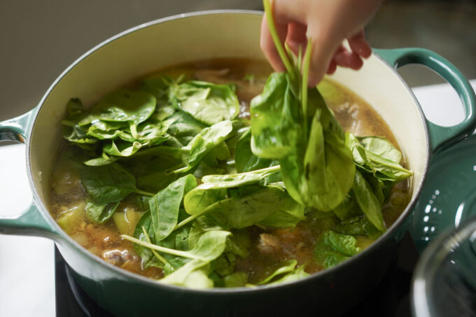 adding all the spinach