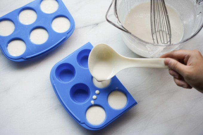 scooping batter into puto molds