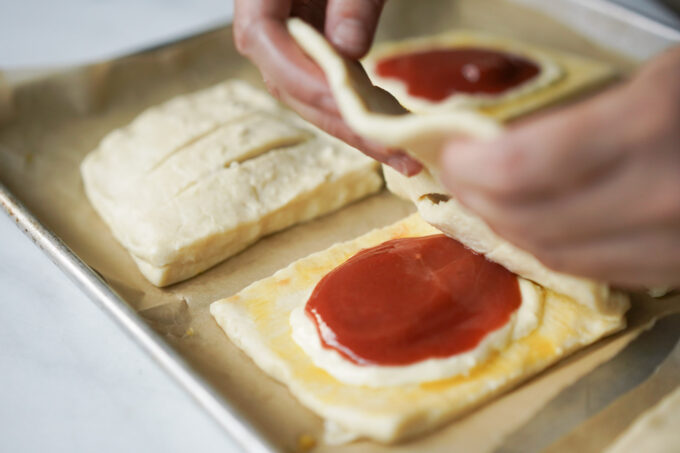 adding top layer to pastries