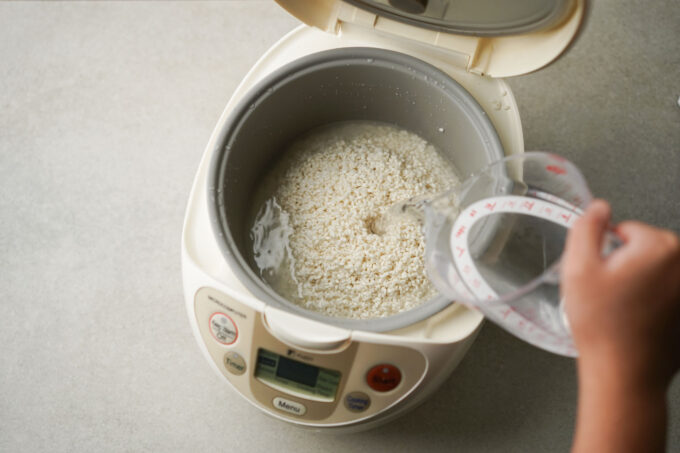 pouring water into rice cooker