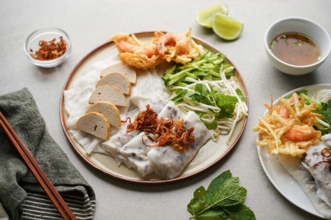 banh cuon plate with herbs, veggies, fish sauce