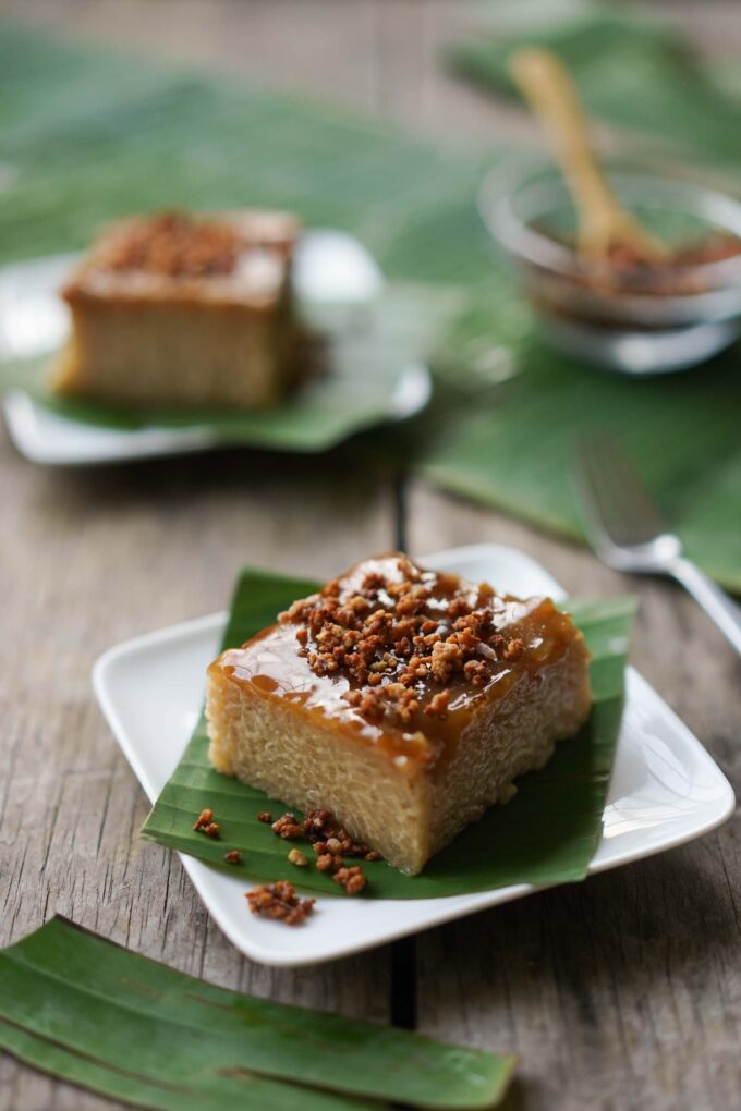 slices of biko rice cake on banana leaves