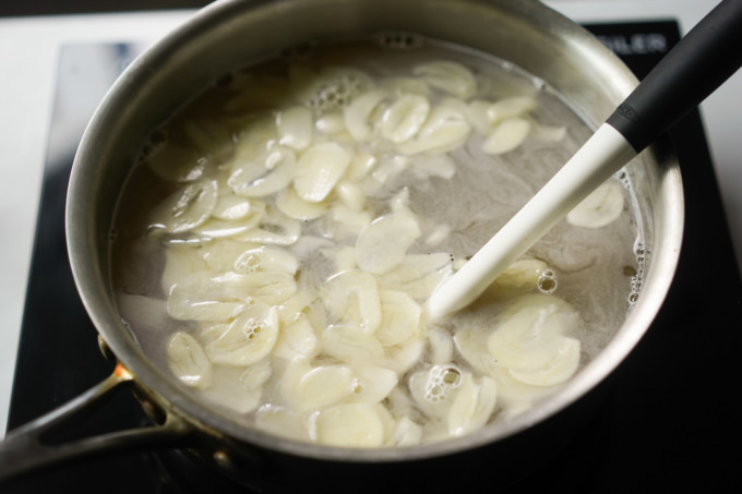 simmered brine with garlic slices in a pot