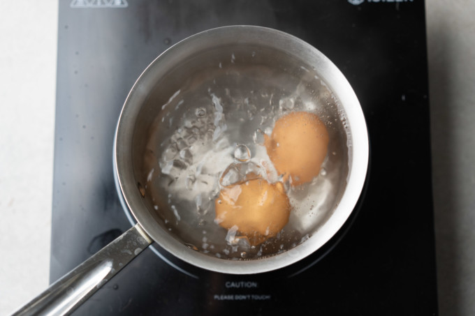 boiling eggs in a pot