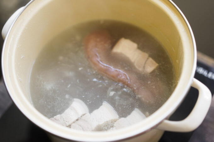 boiling pork ear and belly in stock pot