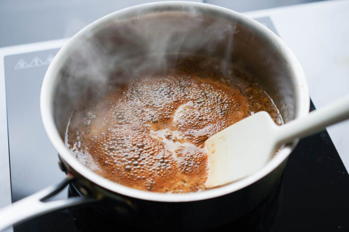 boiling soy glaze in a pot