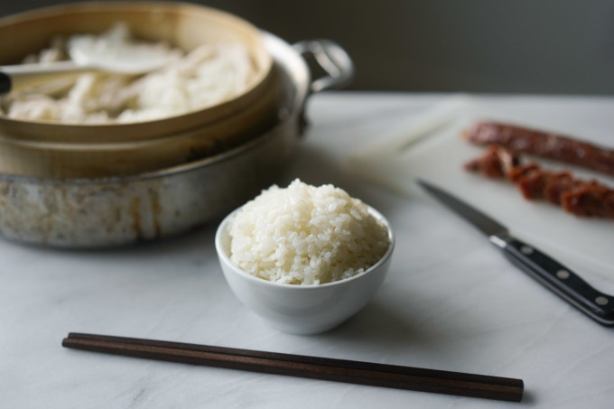 bowl of sticky rice with chopsticks