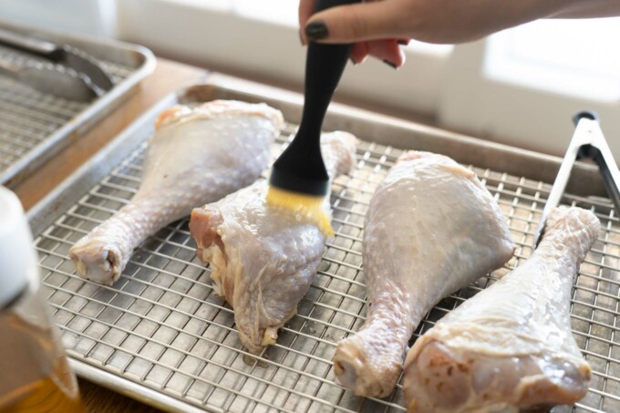 brushing turkey legs with oil