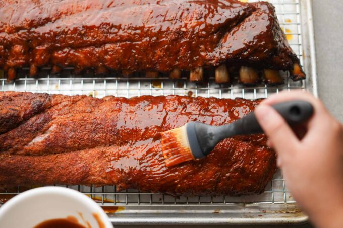 Baby back ribs seasoned with Meat Church Honey Hog bbq, cooked with the  3,2,1 method 180f 3 hrs 225f wrapped 3 hrs 225 unwrapped 1 hr. During the  wrap I put brown