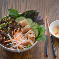 bowl of bun thit nuong with dipping sauce