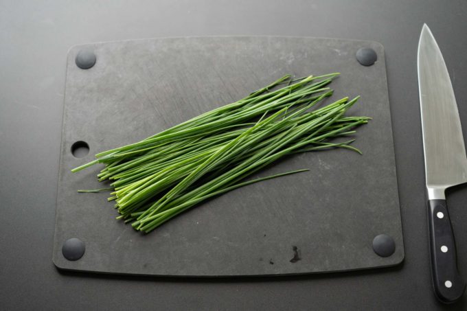 bunch of chives on cutting board
