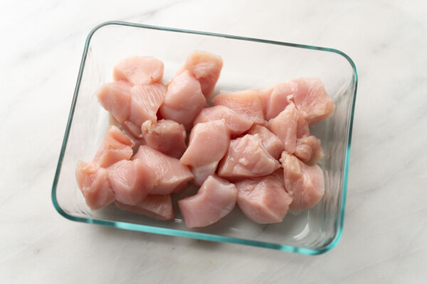 cubed chicken breast in glass container