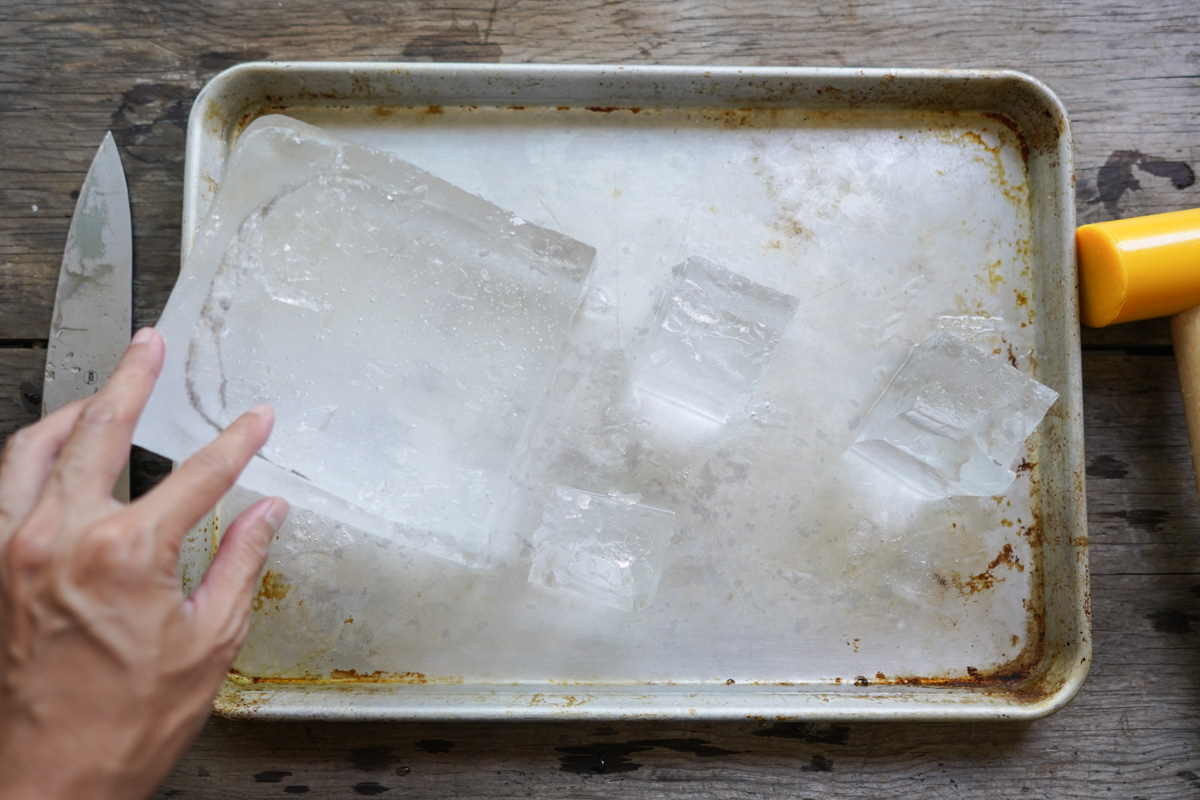 chopping off ice impurities and shaping into cubes