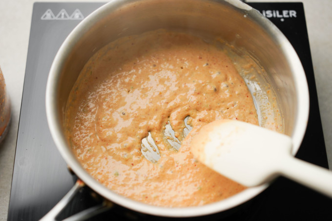cooking curry paste with coconut milk