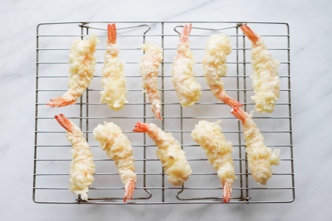 shrimp tempura cooling on a rack