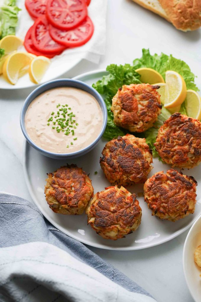 crab cake sauce with plate of crab cakes