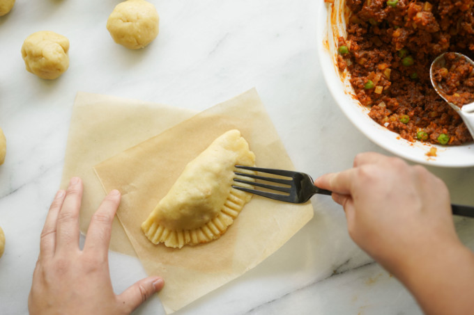 crimping dough edges with fork