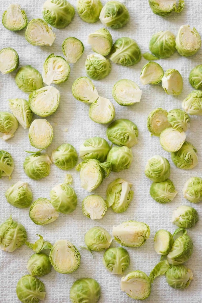 cut up brussels sprouts drying on a towel