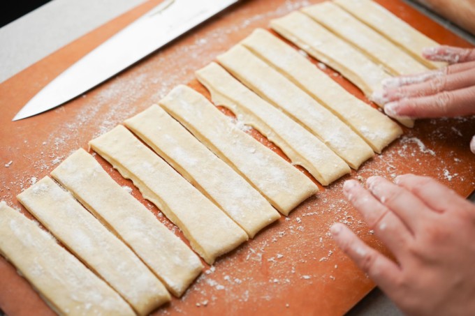 dough cut into 12 strips