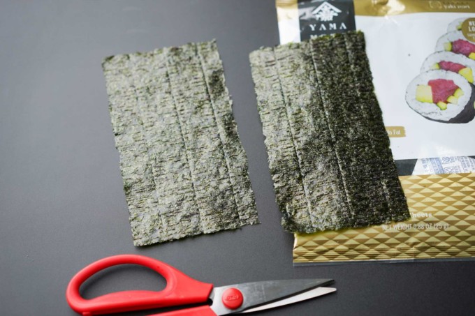 sheets of halved nori and scissors