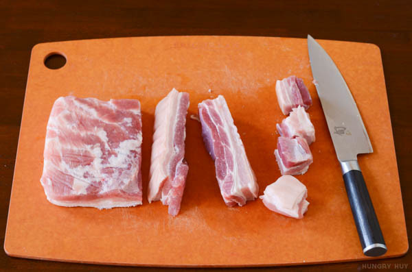 cutting pork belly into cubes