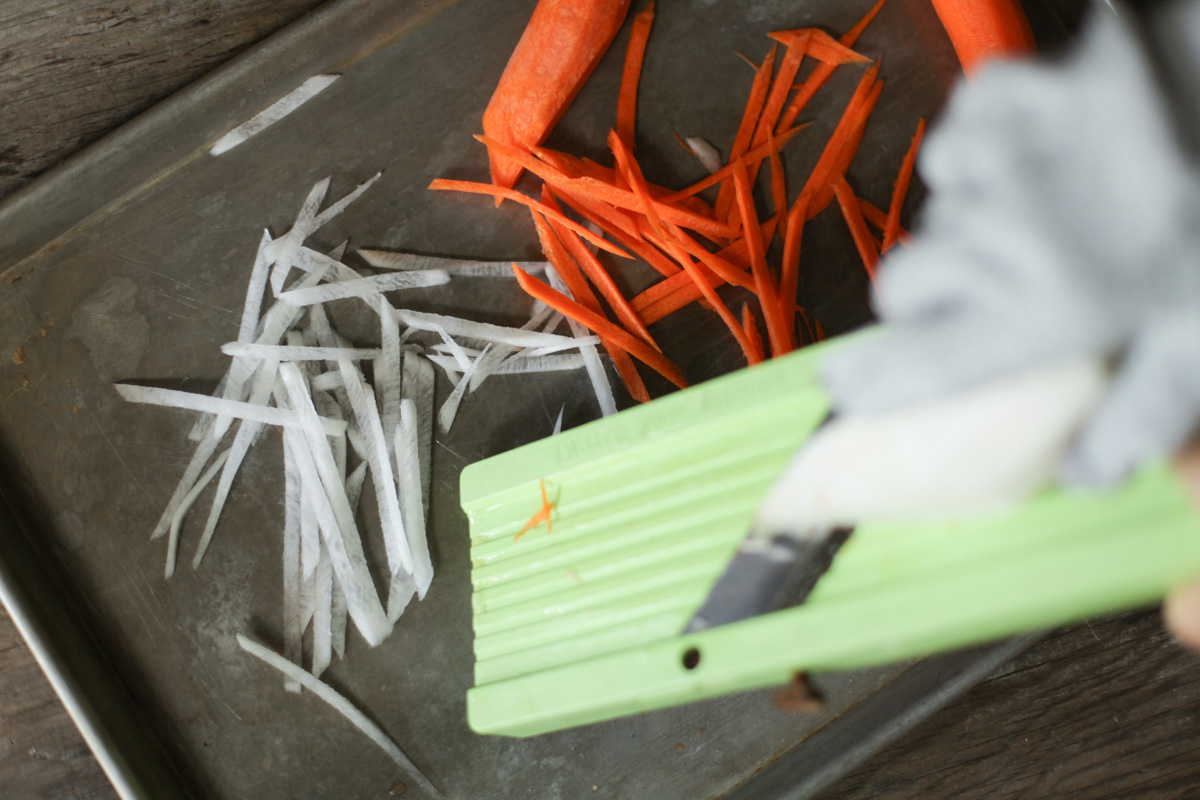 a mandolin slicer with cut proof glove