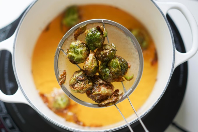 draining fried brussels sprouts