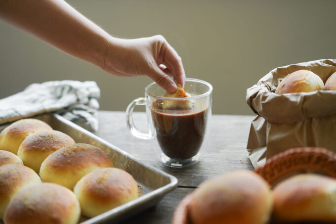 dipping pandesal in hot chocolate