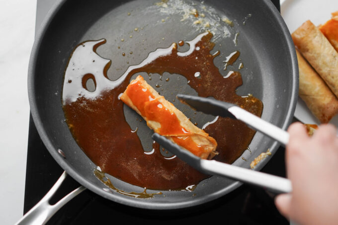 dipping turon in caramel