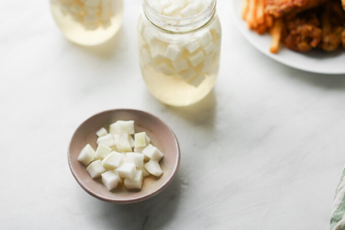 serving daikon pickles with Korean fried chicken