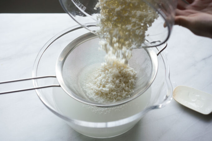 draining water from soaked sticky rice