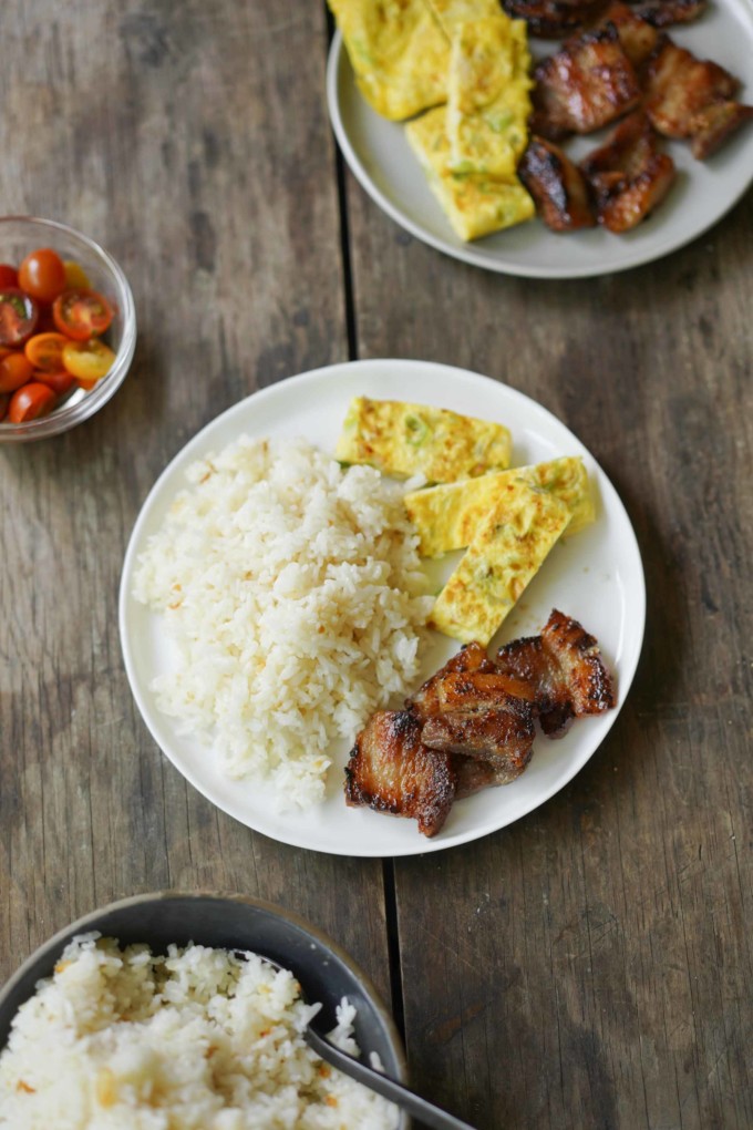 Filipino breakfast with garlic rice, tocino, egg, tomato