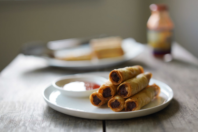 Filipino lumpiang shanghai rolls with sweet and sour dipping sauce
