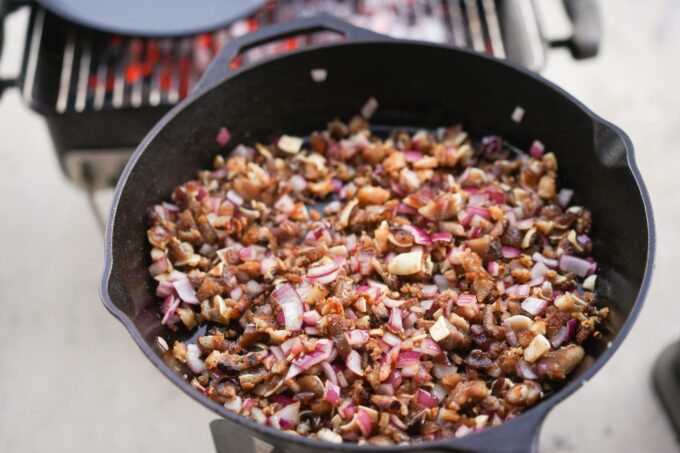 finished sisig resting in cast iron off the heat