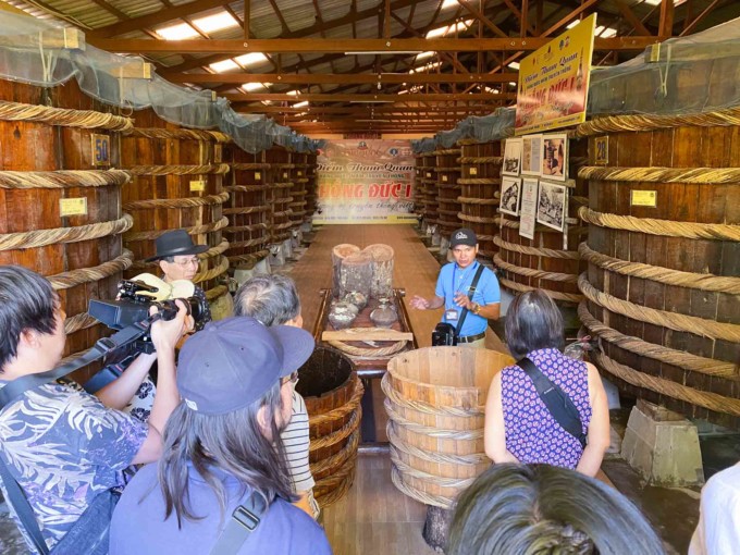 my family on a tour of a fish sauce factory in Phu Quoc