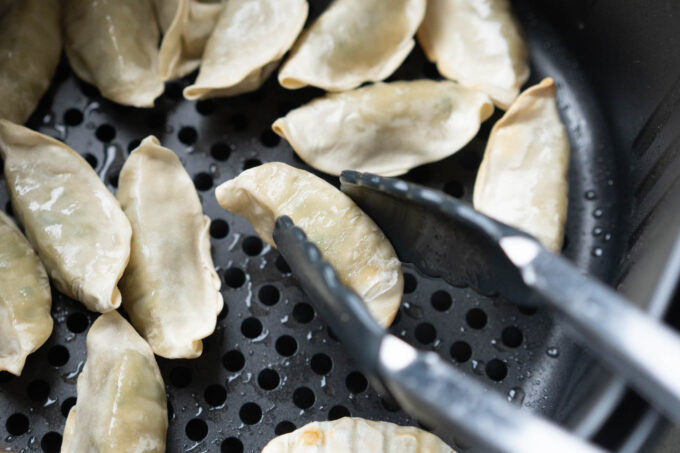 flipping over dumplings in air fryer