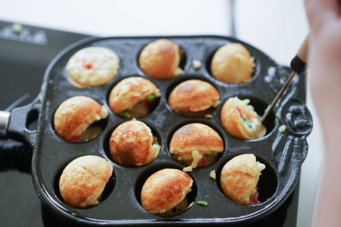 flipping takoyaki balls in the pan