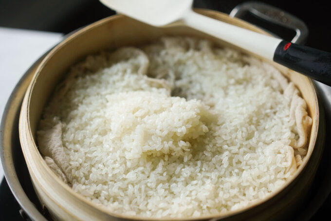 cooked sticky rice in bamboo steamer