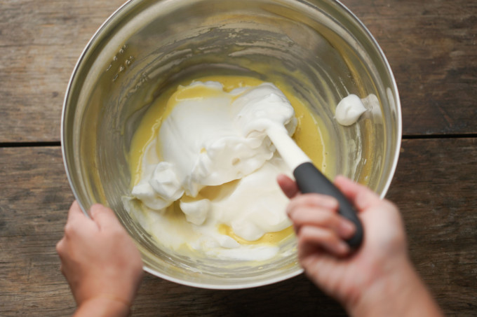 folding meringue into the batter with a spatula