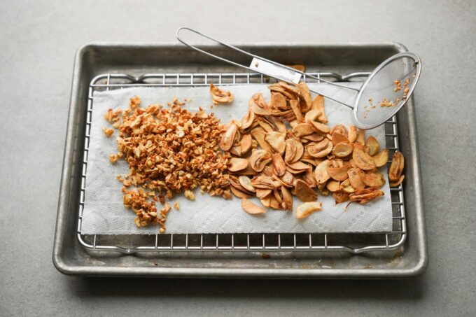 fried garlic chips cooling on rack