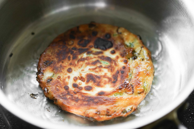 fried scallion pancake in a pan