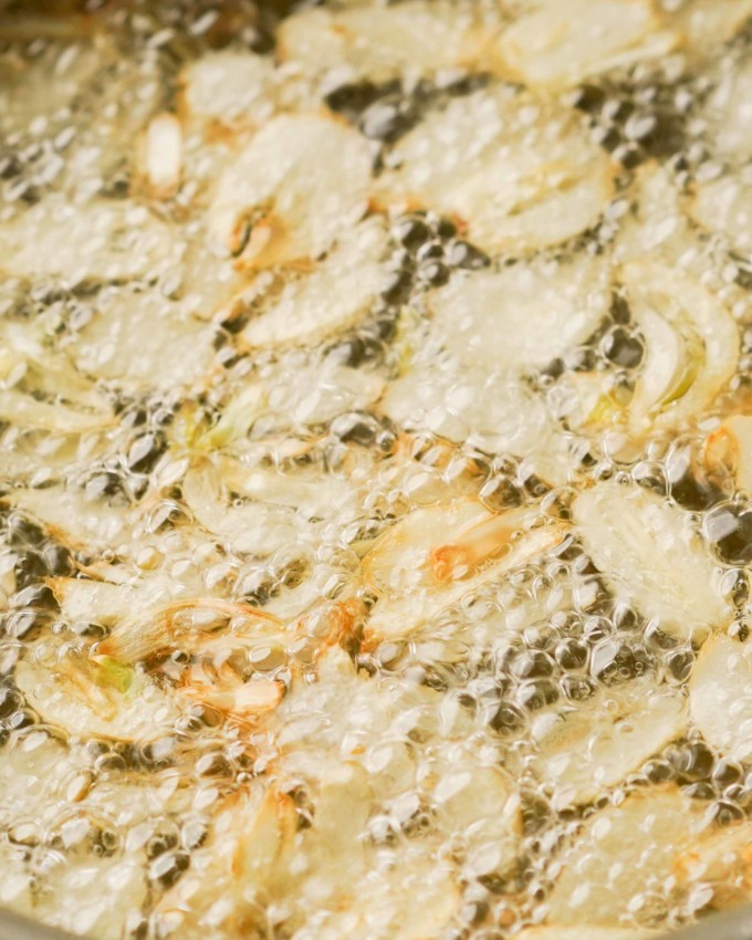 bubbling garlic frying in oil